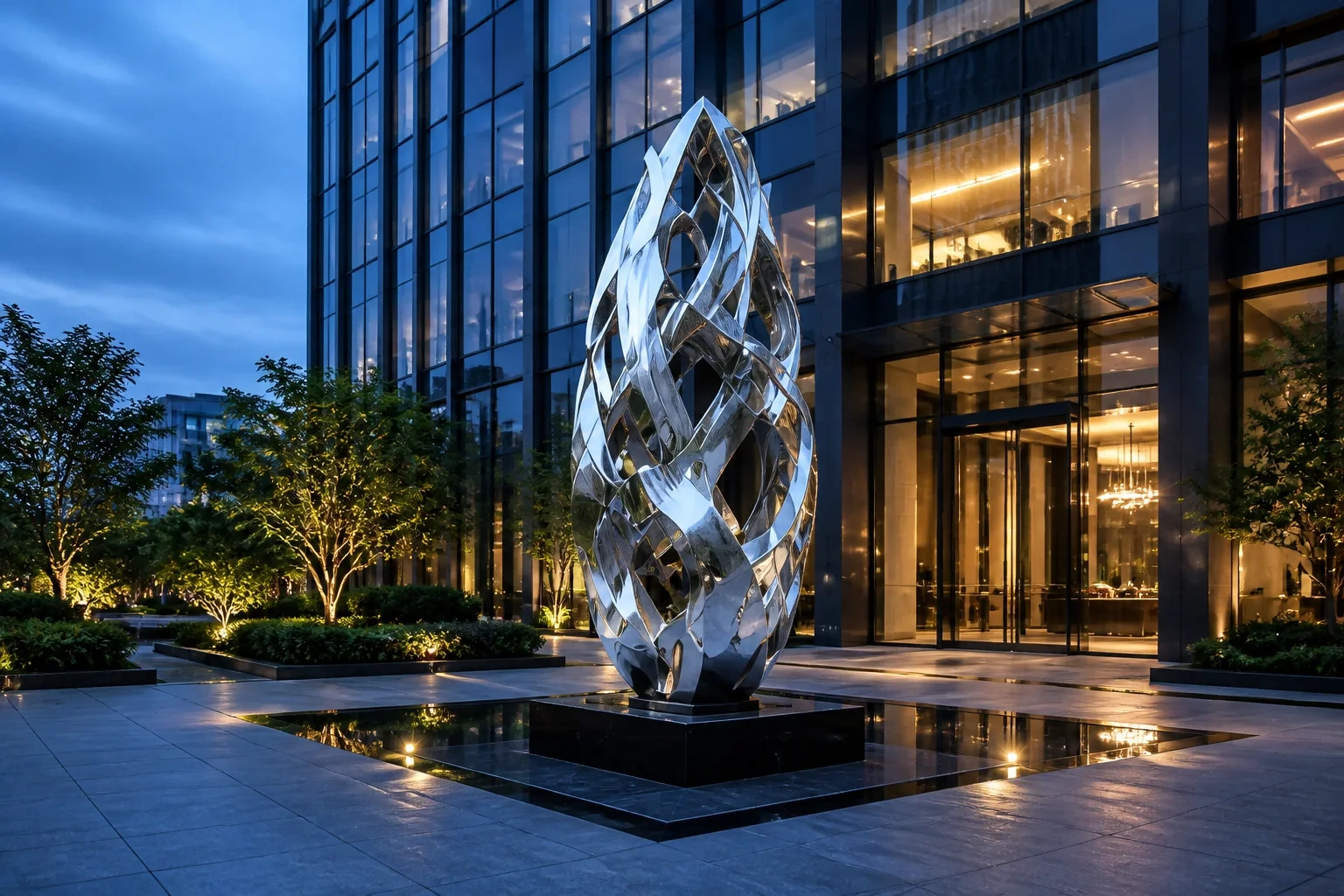 Abstract stainless steel flame sculpture outside a commercial building